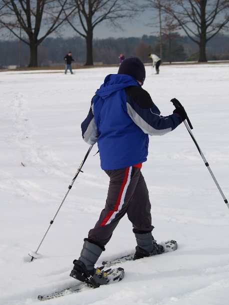 A person skiing in the snow Description automatically generated