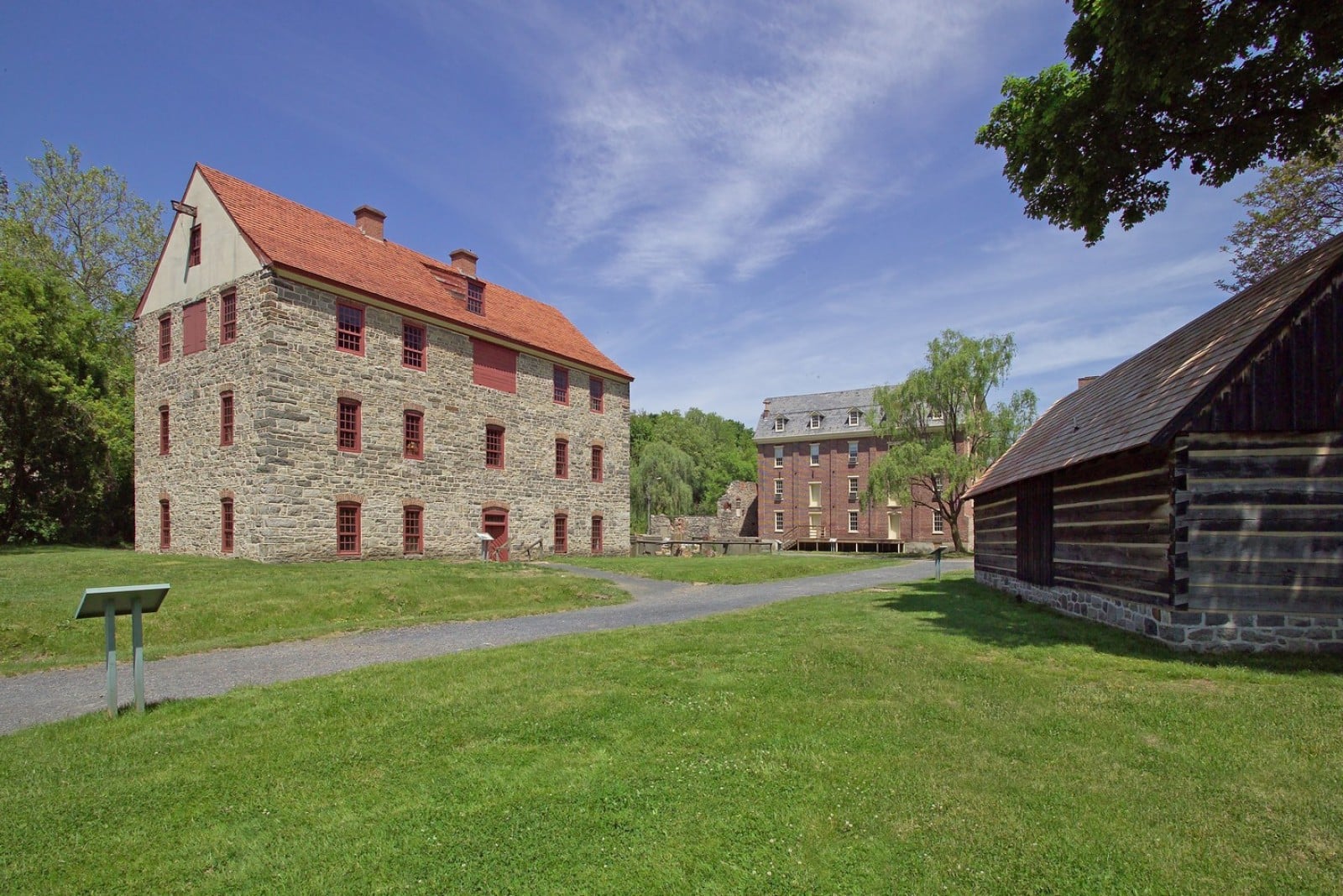 A stone building with red roof Description automatically generated